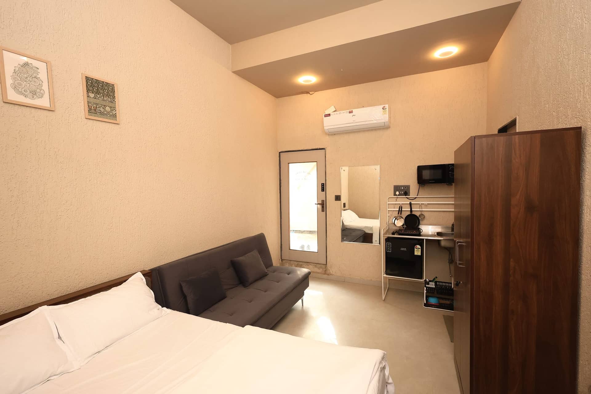 Azai studio with a bed, sofa lounge and kitchenette