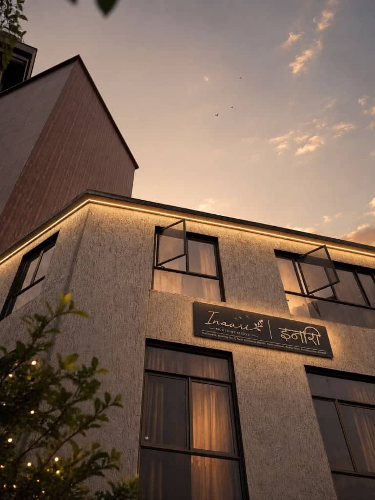 The Inaari building glowing warm at dusk